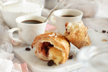 Breakfast with coffee and croissant