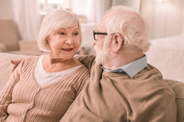 Charming grey-haired male person staring at his partner