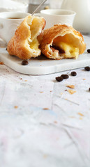 Breakfast with coffee and croissant