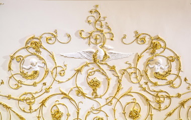 Vintage elegant golden baroque ornament on the wall