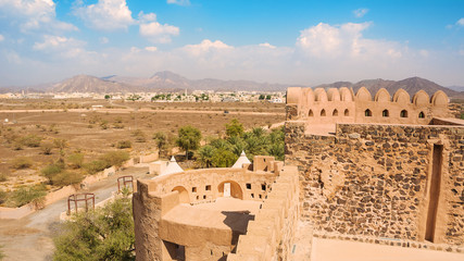 Details of the castle of Jabrin and in the background Bahla and Jebel Shams mountains
