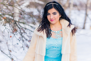 Cold season concept,  fashionable arabic woman in fur coat, fashion for lady