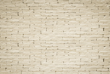Brick wall pattern texture background painted in light yellow beige color