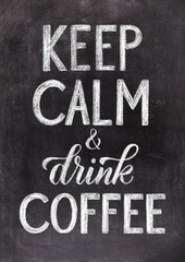 Keep calm and drink coffee lettering. Hand drawn vintage chalk illustration on black chalkboard background. 