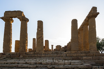 Fototapeta na wymiar Doric columns of the Temple of Juno at Valle dei Templi (Valley of the Temples), one of the most important archeological site for greek art and architecture, Agrigento, Sicily, Italy