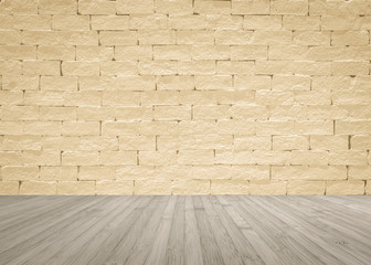 Grunge brick wall painted in light yellow beige with wooden floor in sepia brown with vignette for interior backgrounds