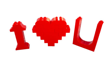 i love you  from red toy plastic blocks on white background. valentine's day concept