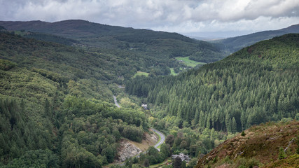 Landscape image of view from Precipice Walk in Snowdonia overlooking Barmouth and Coed-y-Brenin forest during rainy afternoon in September