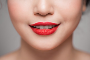 Fototapeta premium Close-up of beautiful perfect red lips. Selective focus.