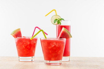 Healthy watermelon smoothie on a wood background