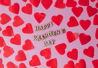 Many hearts with an inscription Happy Valentine's Day on a pink background.. Background for a greeting card for Saint Valentine's Festive concept for Valentine's day, Mother's day or birthday