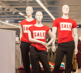 Part of female mannequin dressed in casual clothes with sale text in the shopping department store for shopping, business fashion and advertisement concept