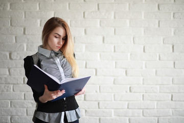 Young pretty blonde girl student