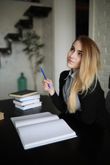 Young pretty blonde girl student