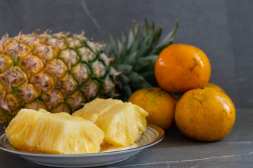 Fototapeta na wymiar Fresh fruit, Pineapple and oranges.