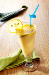 Delicious juice drink on wood grain background