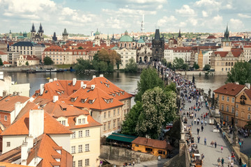 Naklejka na ściany i meble Top view on crowd of tourists on Charles bridge in Prague, Czech Republic