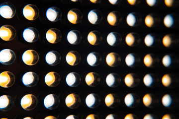 Many shines dry light bulbs of different colors. LED lighting device for videographers.