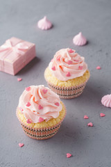 Vanilla cupcakes with pink raspberry frosting for Valentine's Day