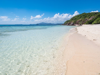 Beautiful white sand beach and blue sky. Coron, Busuanga island, Palawan province, Philippines. November, 2018