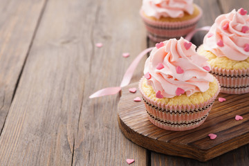 Valentine's Day cupcakes decorated with heart shaped candy.