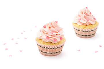 Pink cupcakes with candy for Valentine's Day. Isolated.