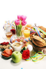 breakfast on table with bread buns, croissants, coffe and juice on carnival