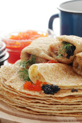 Russian pancakes with red and black caviar	