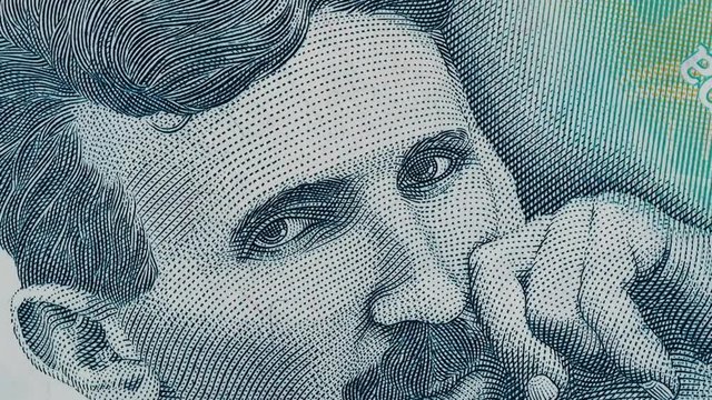 Nikola Tesla portrait on Serbia 100 dinars slow rotating. Genius scientist and inventor. Stock video footage.