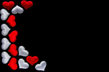 Lots of white and red hearts on black background