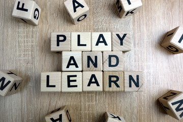 Play and learn text from wooden blocks on desk - obrazy, fototapety, plakaty