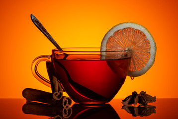 A cup of black tea with a slice of lemon. - 244167249
