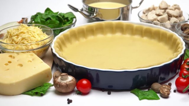 shortbread dough for baking quiche tart in baking form and ingredients