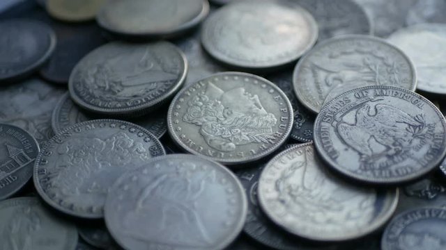 Pile Of One Dollar Coins. Loop 4K