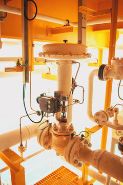 Actuated control valve fail to open type and valve positioner control by programmable logic controller (PLC) to control oil and gas conditioning process. Offshore power and energy business industry. 