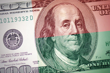 Obraz na płótnie Canvas flag of madagascar on a american dollar money background