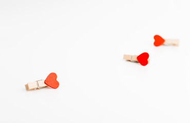 Three cloth pin with heart. Space for text. Valentine's Day. Love concept.