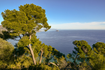 Panoramic view of the Ligurian Sea with the Gallinara Island from the cape of Capo Mele, Liguria, Italy