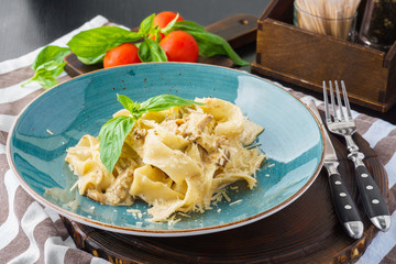 Italian pasta pappardelle with wild mushrooms and creamy sauce.