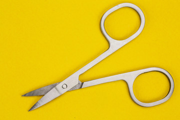 new sewing scissors on a yellow background