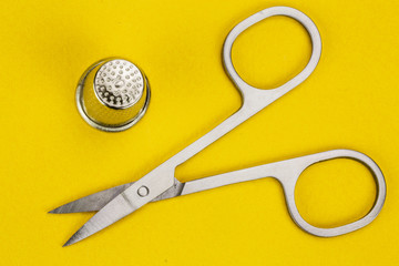 new sewing scissors on a yellow background