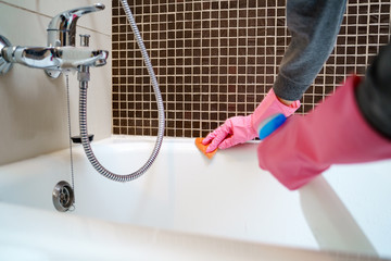 Picture of female hands with detergent washing bath