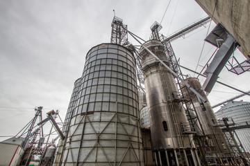 Agricultural Industrial Background. Huge metal grain silos in the heartland of the American Midwest.