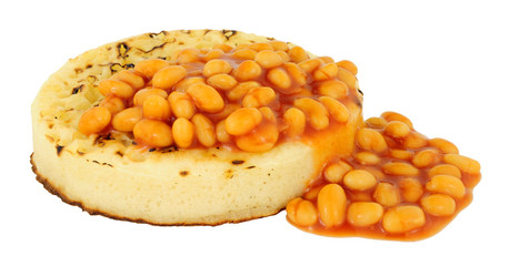 Baked beans on a large English crumpet isolated on a white background
