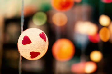 Lanterns with hearts, with bokeh and blur, festive background, valentine's day concept