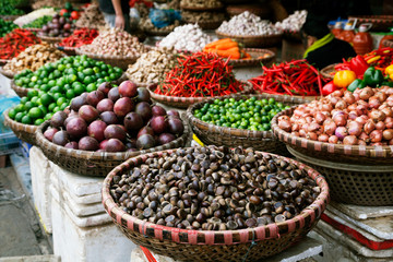 Fototapeta na wymiar Fruits and spices at a market in Vietnam