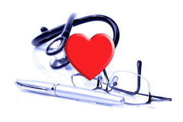 Heart, glasses, a pen and stethoscope on the white background. Keep your heart consept.