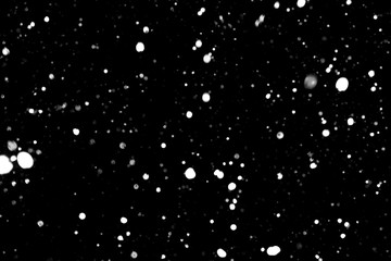 falling snow, snowfall at night, snowflakes on a black background