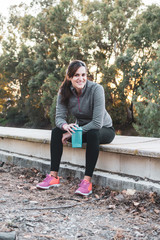 young woman drinking to do sports