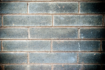 front on view of a gray brick wall backgound